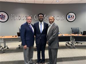 Dr. Donaldson flanked by Dr. Nichols, left' and Mr. Eric Terrell.